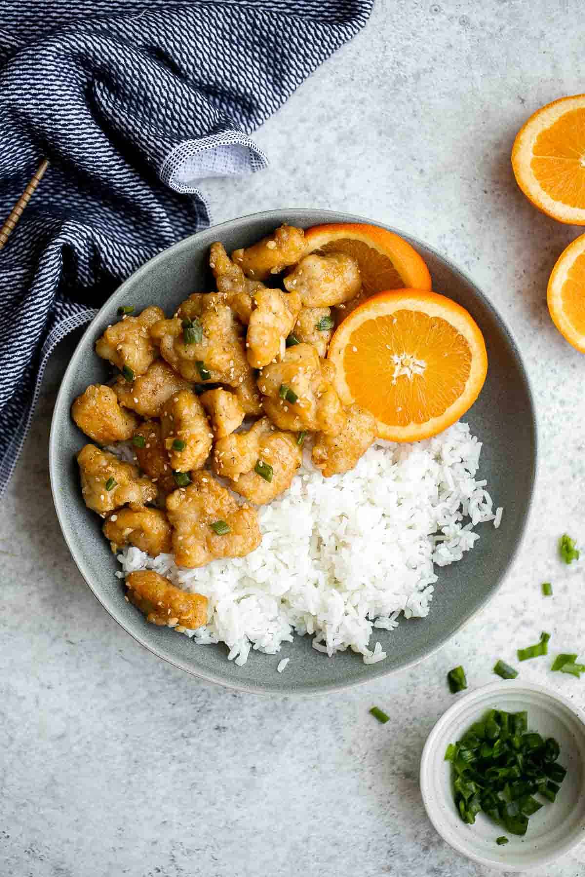 Chinese Takeout Orange Chicken is a quick, easy, delicious meal ready in 30 minutes. It’s healthier than takeout — can be pan-fried, air fried, or baked. | aheadofthyme.com