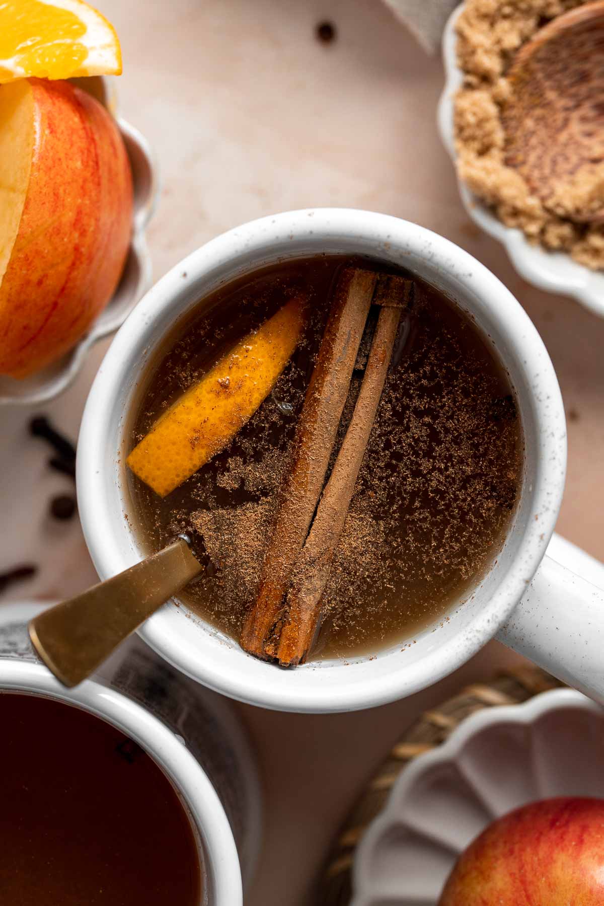 This slow cooker apple cider is quick and easy to prepare, with hints of cinnamon, cloves, allspice, and orange — a rich and flavorful fall drink. | aheadofthyme.com