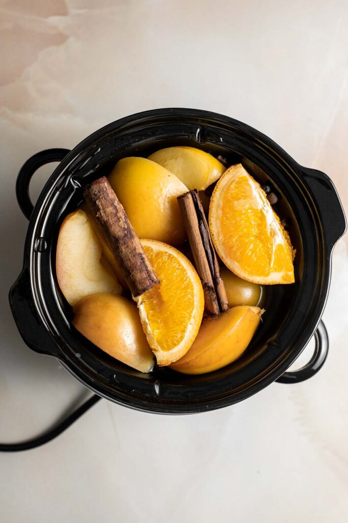 This slow cooker apple cider is quick and easy to prepare, with hints of cinnamon, cloves, allspice, and orange — a rich and flavorful fall drink. | aheadofthyme.com