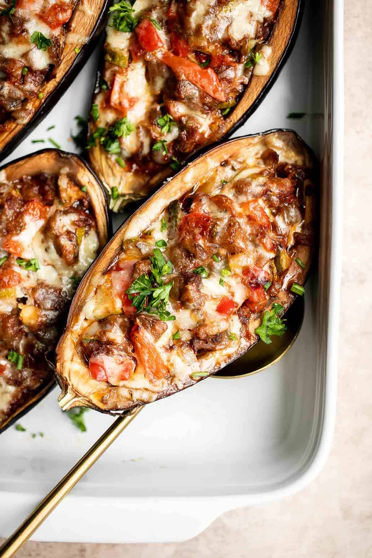 This Mediterranean Stuffed Eggplant is delicious, filling, and healthy. This vegetarian dinner is loaded with veggies and topped with bubbly cheese. | aheadofthyme.com