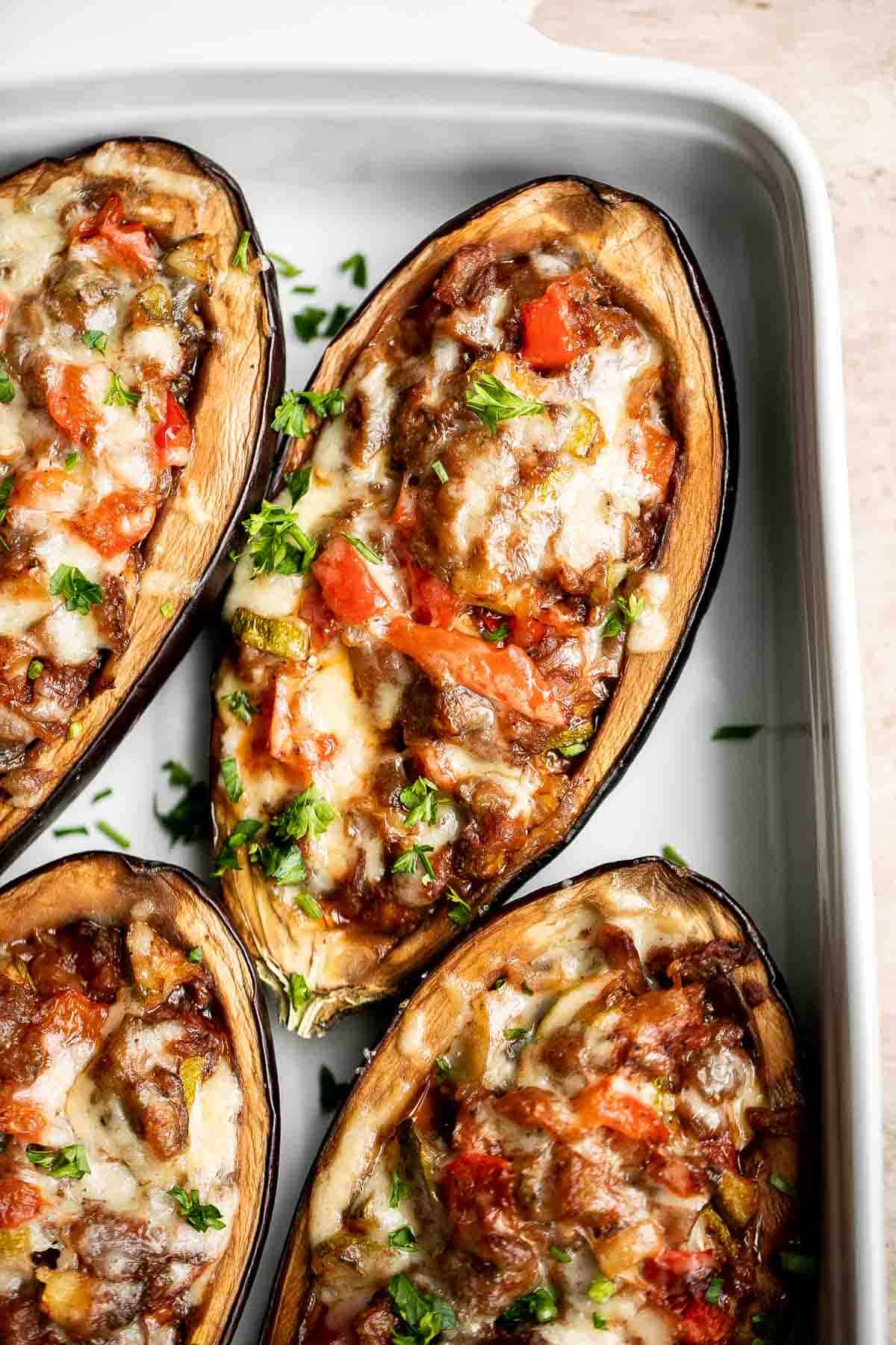 This Mediterranean Stuffed Eggplant is delicious, filling, and healthy. This vegetarian dinner is loaded with veggies and topped with bubbly cheese. | aheadofthyme.com