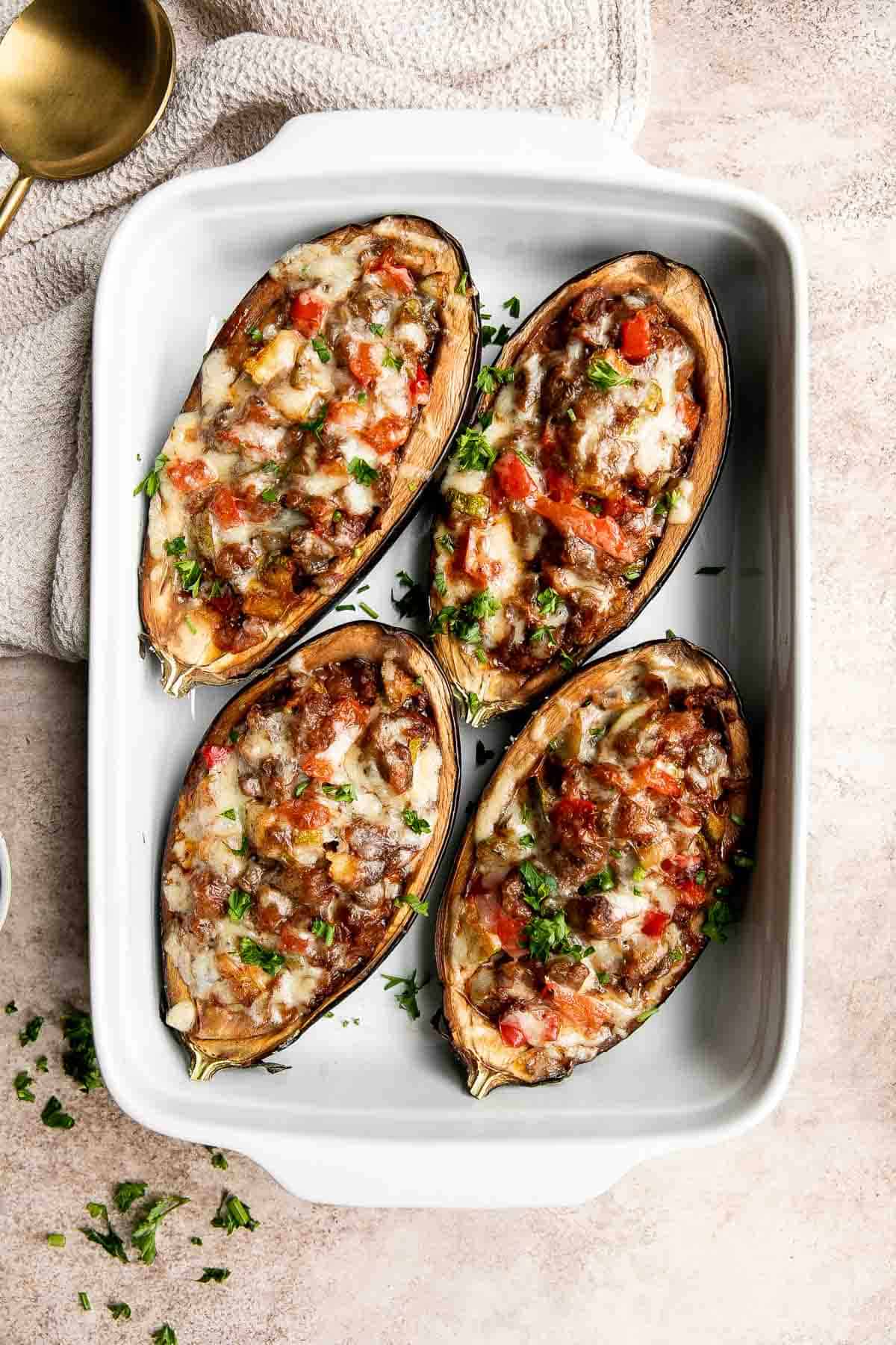 This Mediterranean Stuffed Eggplant is delicious, filling, and healthy. This vegetarian dinner is loaded with veggies and topped with bubbly cheese. | aheadofthyme.com