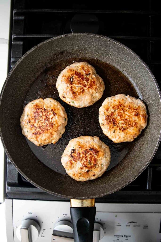 These Thai Turkey Burgers topped with a crisp and creamy slaw are loaded with fresh and bright flavors, healthy and delicious, and quick and easy to make. | aheadofthyme.com