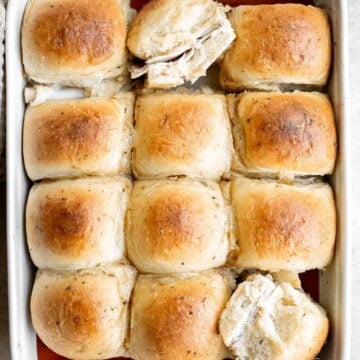 Turkey and Cheese Sliders are quick and easy, made with deli meat and Swiss cheese filled inside soft Hawaiian dinner rolls topped with a buttery sauce. | aheadofthyme.com