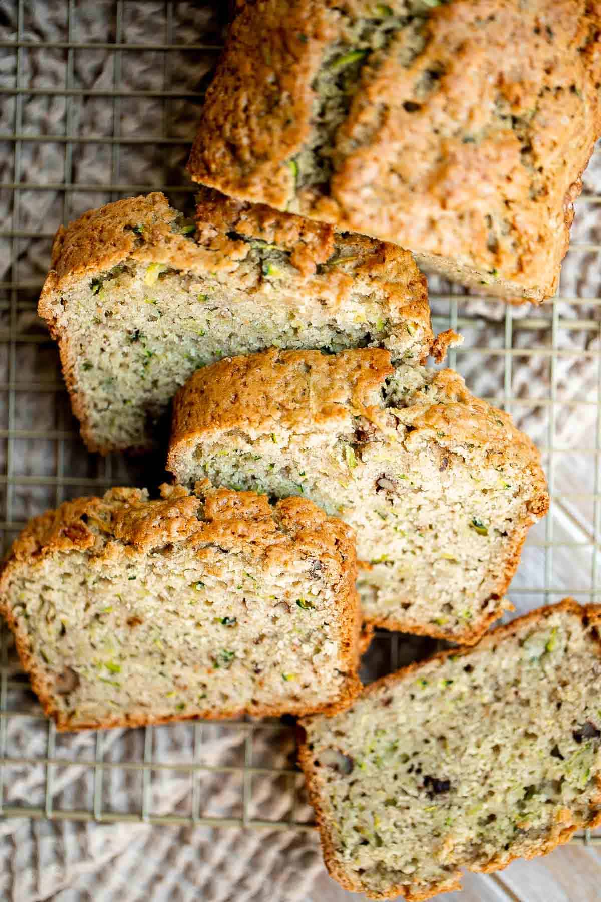 This easy Zucchini Bread is moist, light, and fluffy. It’s loaded with real zucchini — but you wouldn’t even know it because you can’t taste it! So good. | aheadofthyme.com