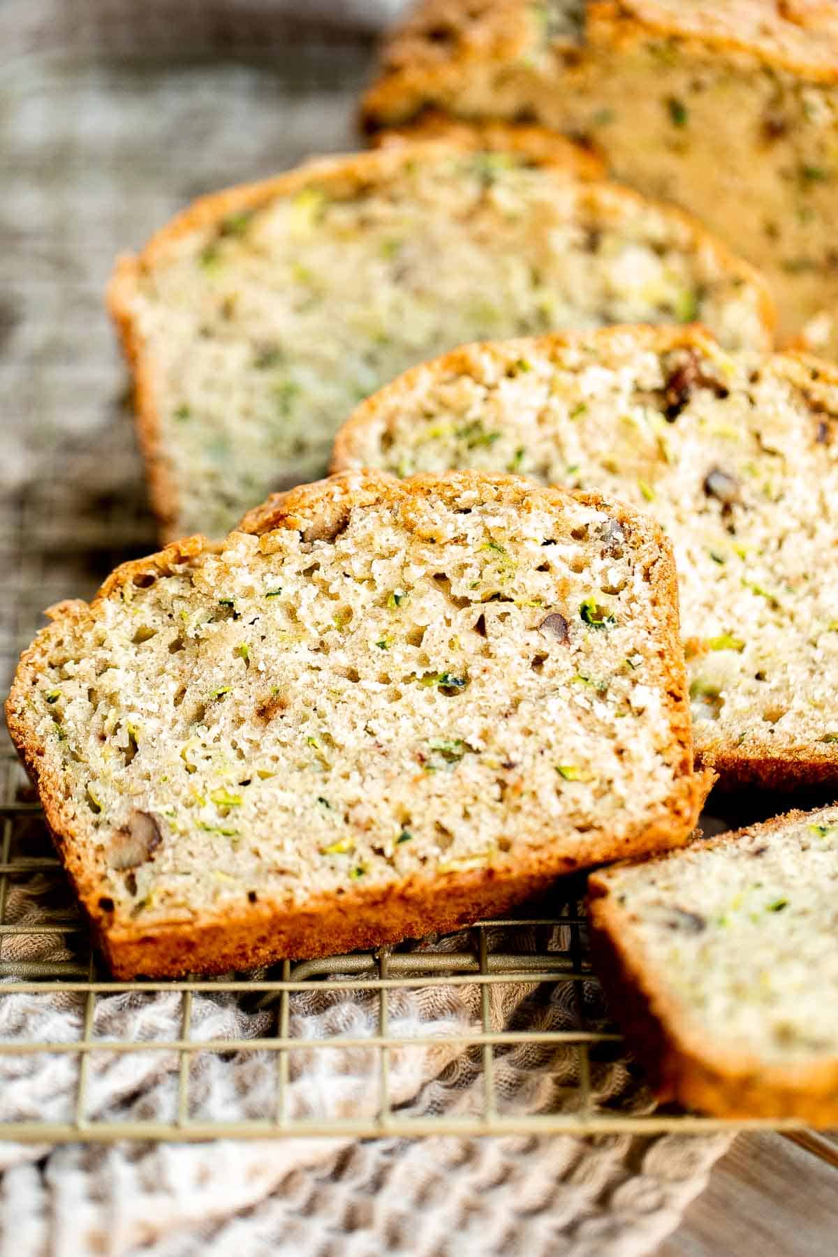 This easy Zucchini Bread is moist, light, and fluffy. It’s loaded with real zucchini — but you wouldn’t even know it because you can’t taste it! So good. | aheadofthyme.com