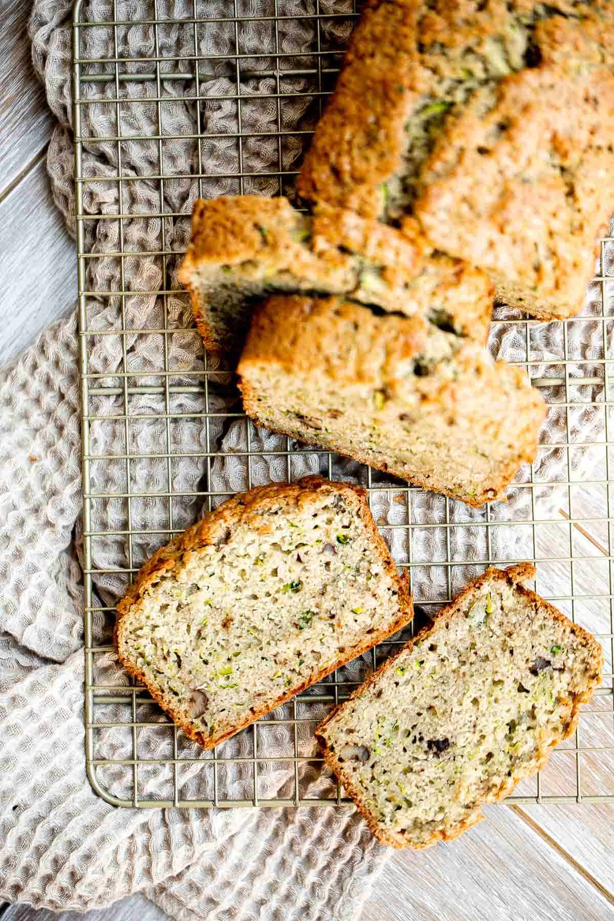 This easy Zucchini Bread is moist, light, and fluffy. It’s loaded with real zucchini — but you wouldn’t even know it because you can’t taste it! So good. | aheadofthyme.com