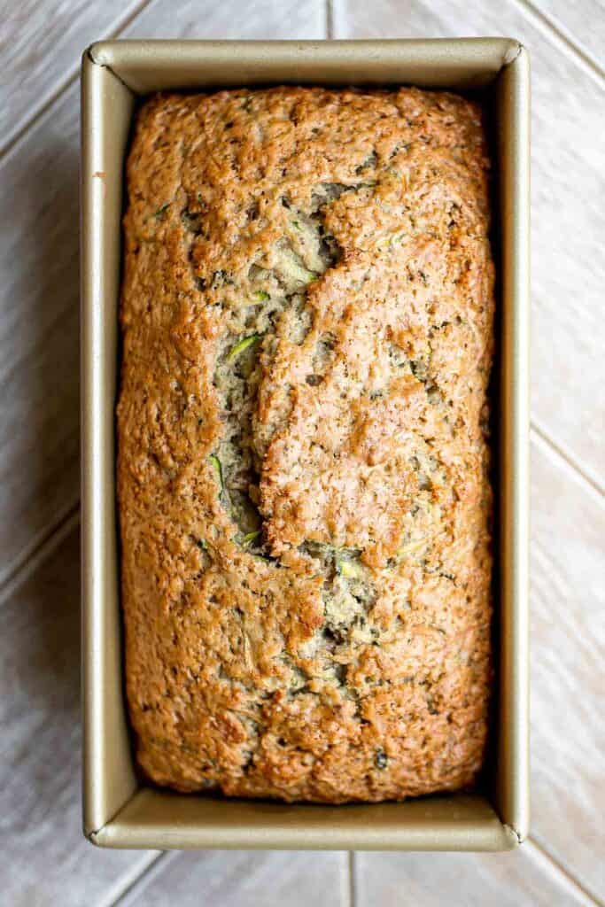 This easy Zucchini Bread is moist, light, and fluffy. It’s loaded with real zucchini — but you wouldn’t even know it because you can’t taste it! So good. | aheadofthyme.com