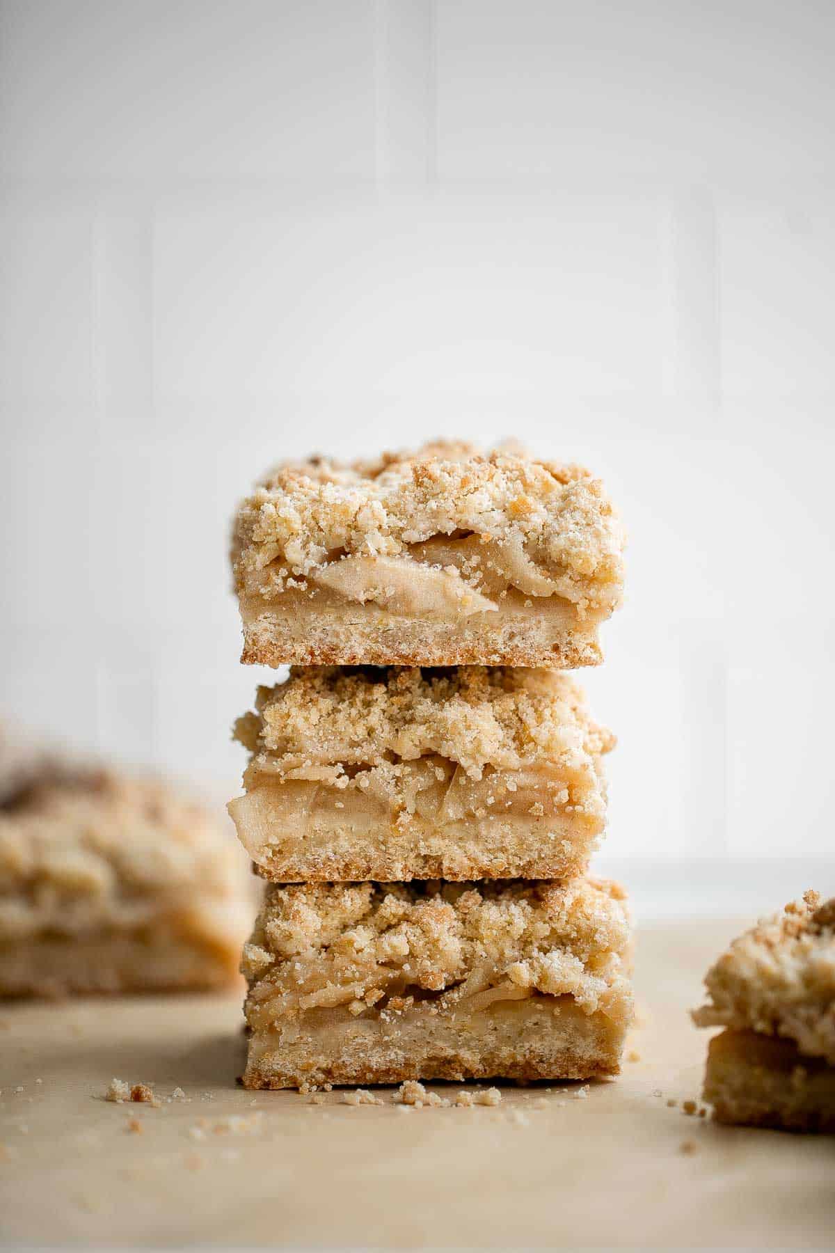 Homemade Apple Pie Bars are sweet, tart, and crumbly. With 3 delicious layers including a flaky pastry crust, cinnamon apple filling, and crumbly topping. | aheadofthyme.com