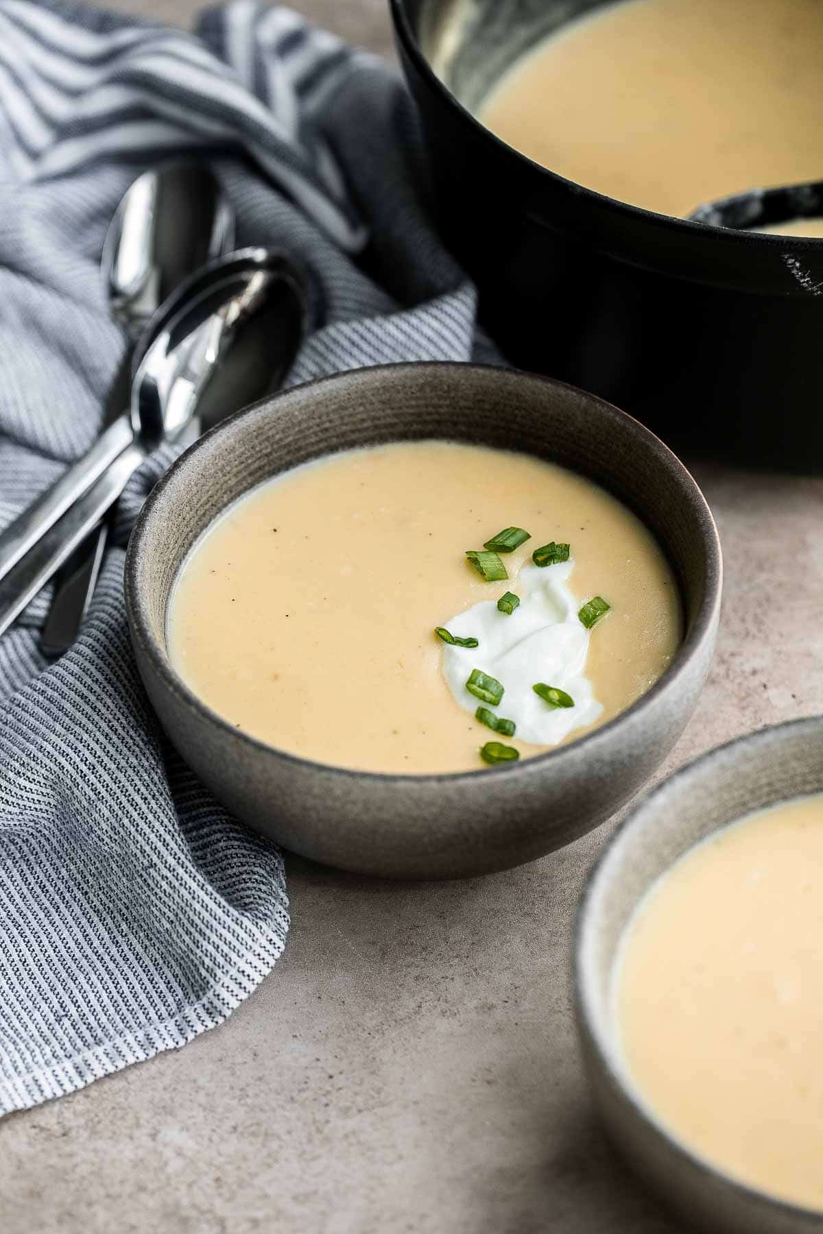 Cheesy Potato Soup is creamy, delicious, and comforting. This recipe takes everyday ingredients and transforms them in 30 minutes to a rich, luscious soup. | aheadofthyme.com