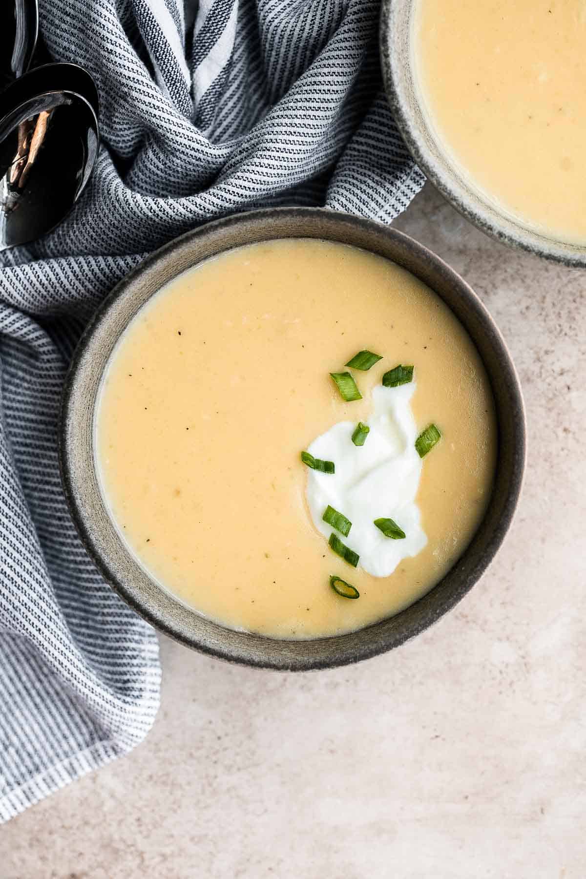 Cheesy Potato Soup is creamy, delicious, and comforting. This recipe takes everyday ingredients and transforms them in 30 minutes to a rich, luscious soup. | aheadofthyme.com