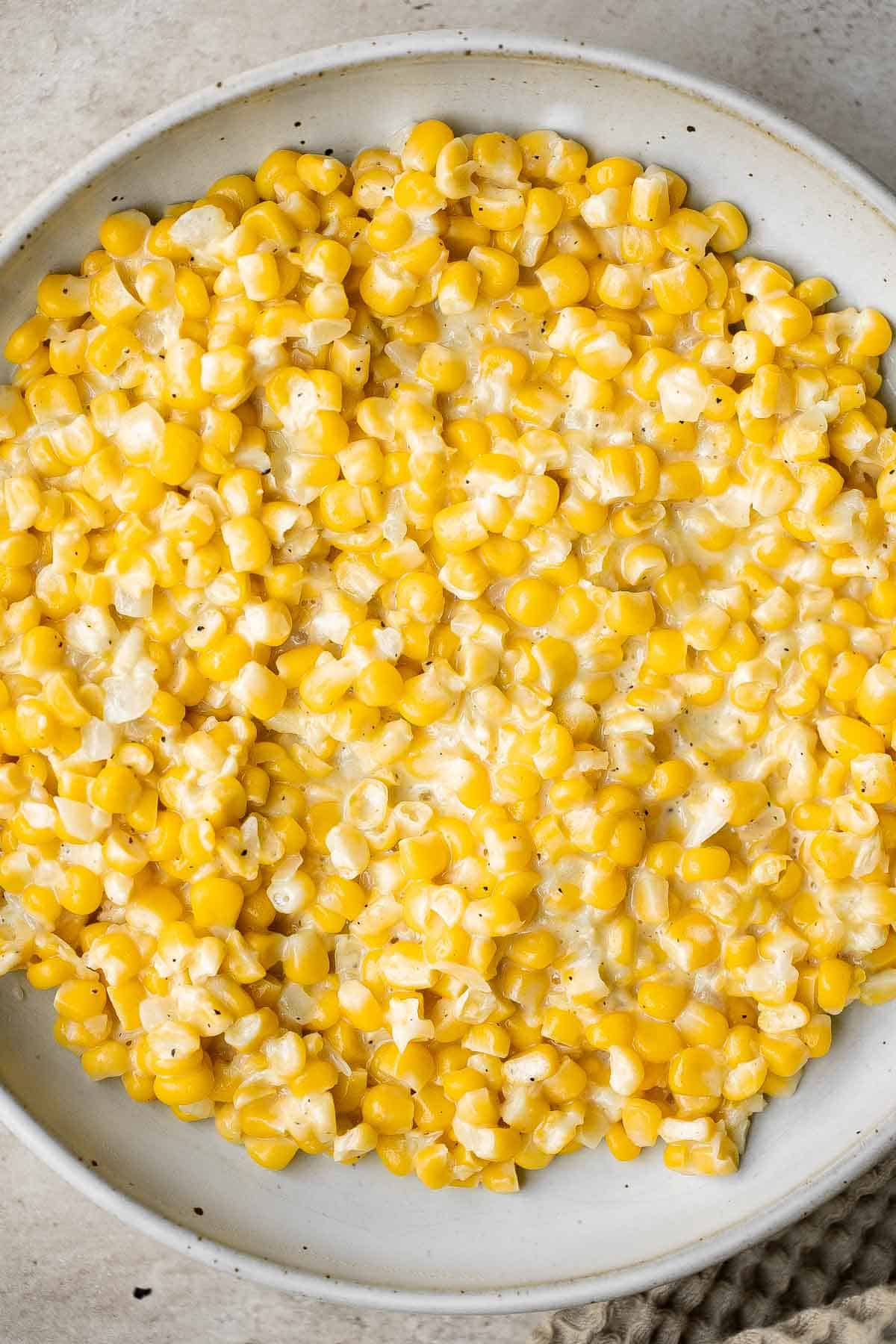 Homemade Creamed Corn is creamy, delicious, and simple. It’s quick and easy to make at home and so much better than store-bought canned creamed corn. | aheadofthyme.com