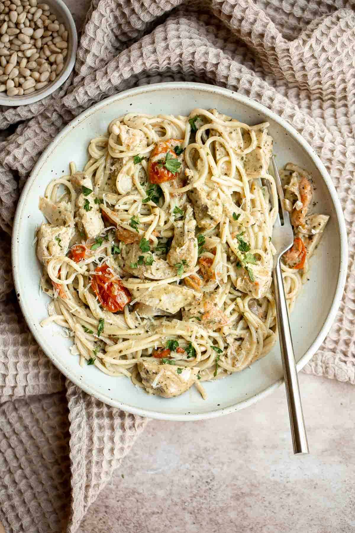 Creamy Chicken Pesto Pasta is a delicious 30 minute recipe that is packed with flavor, quick and easy to make, and will satisfy the whole family. | aheadofthyme.com