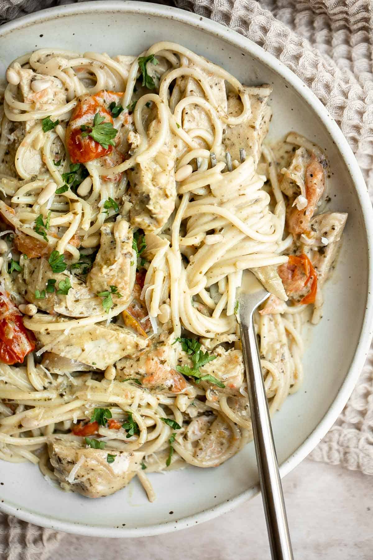 Creamy Chicken Pesto Pasta is a delicious 30 minute recipe that is packed with flavor, quick and easy to make, and will satisfy the whole family. | aheadofthyme.com