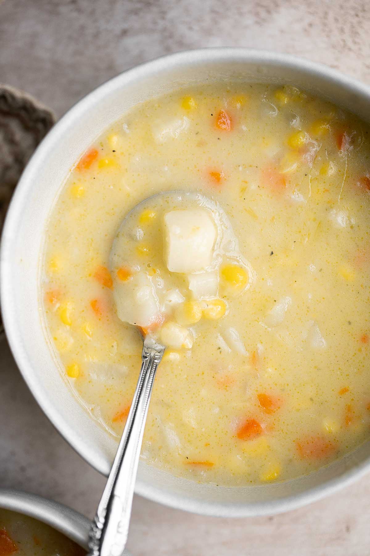 Potato Corn Chowder is rich, creamy, hearty, and delicious. Made with simple ingredients in 35 minutes, this vegetarian soup is perfect for a quick meal. | aheadofthyme.com