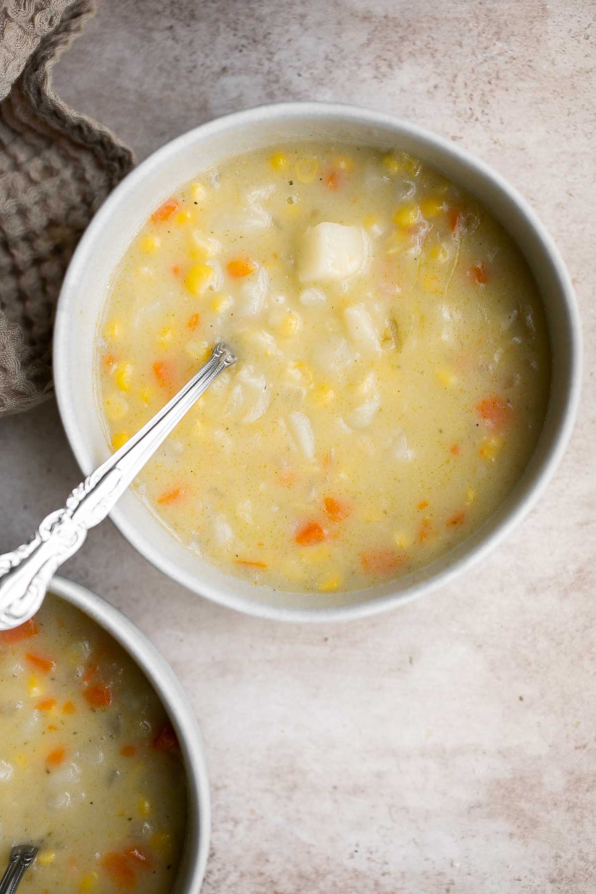 Potato Corn Chowder is rich, creamy, hearty, and delicious. Made with simple ingredients in 35 minutes, this vegetarian soup is perfect for a quick meal. | aheadofthyme.com