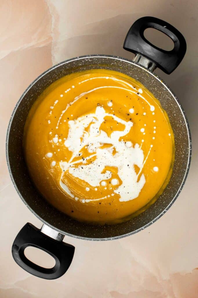 Roasted Acorn Squash Soup is smooth and velvety, packed with veggies, and loaded with fall flavor. Serve for a cozy lunch, dinner, or on Thanksgiving. | aheadofthyme.com