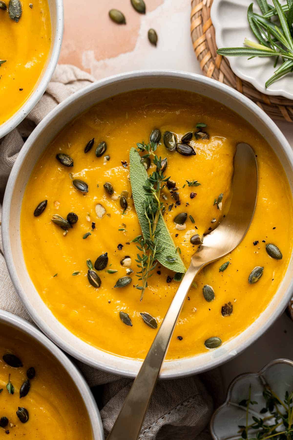 Roasted Acorn Squash Soup is smooth and velvety, packed with veggies, and loaded with fall flavor. Serve for a cozy lunch, dinner, or on Thanksgiving. | aheadofthyme.com