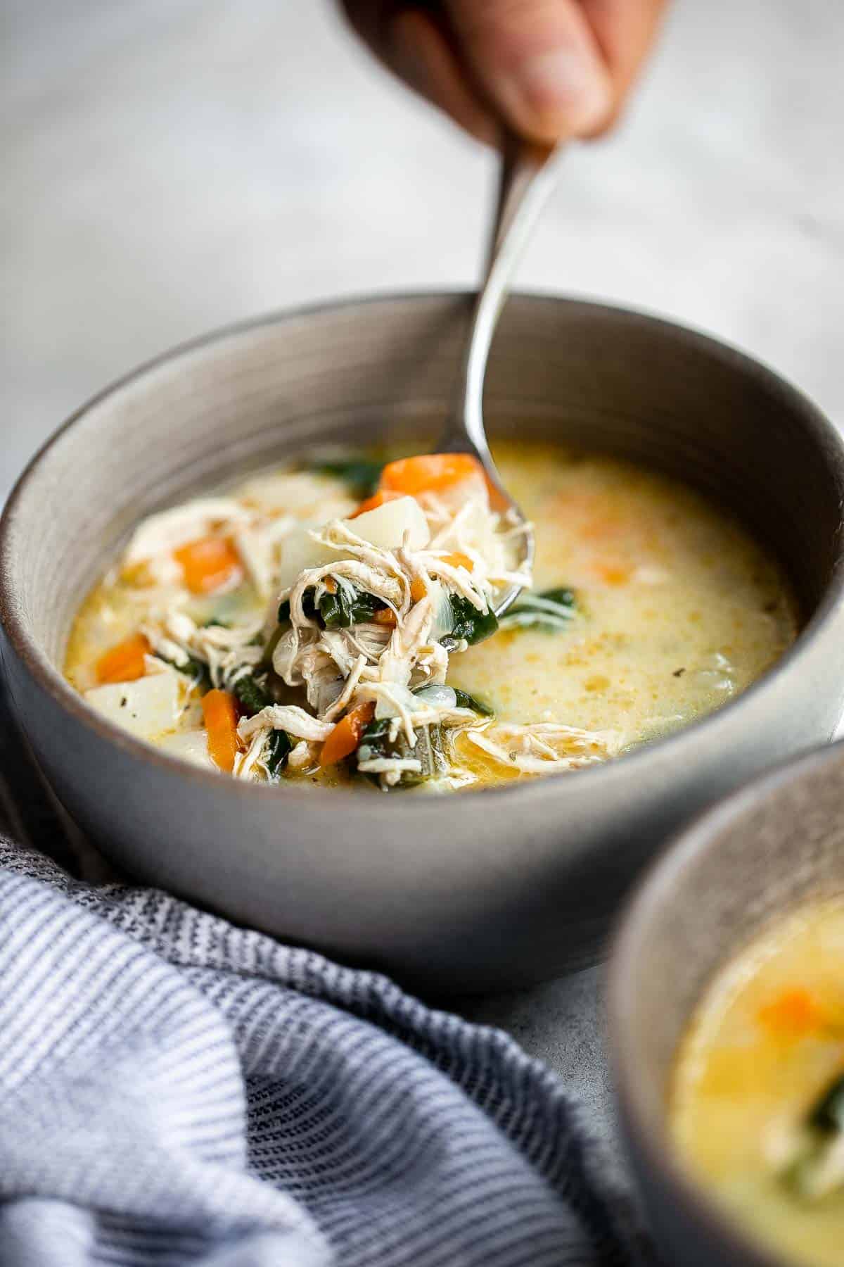 Chicken Potato Soup is cozy, hearty, and delicious — loaded with chicken, potatoes, veggies, and greens simmered in a creamy broth. Ready in 40 minutes. | aheadofthyme.com