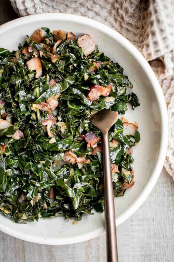 Collard greens with bacon is a flavorful, delicious, and healthy side dish that is quick to make in 25 minutes. A stress-free holiday side for Christmas. | aheadofthyme.com