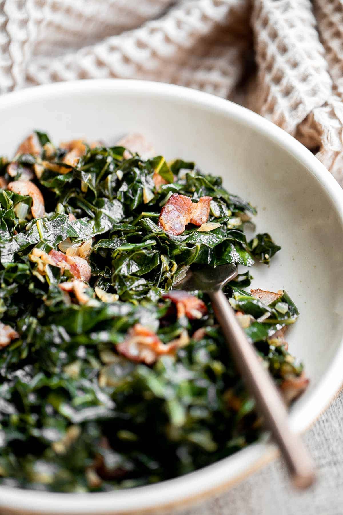 Collard greens with bacon is a flavorful, delicious, and healthy side dish that is quick to make in 25 minutes. A stress-free holiday side for Christmas. | aheadofthyme.com