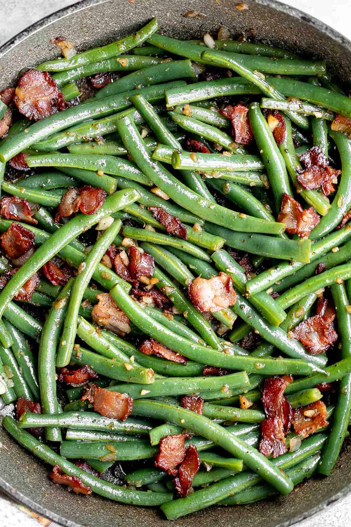 Green Beans with Bacon is a delicious, flavorful side dish that comes together quickly in 20 minutes (including prep!) with a handful of simple ingredients. | aheadofthyme.com