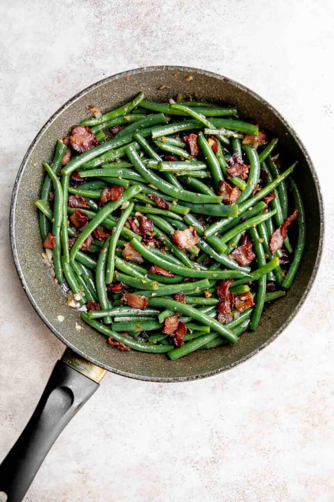 Green Beans with Bacon is a delicious, flavorful side dish that comes together quickly in 20 minutes (including prep!) with a handful of simple ingredients. | aheadofthyme.com