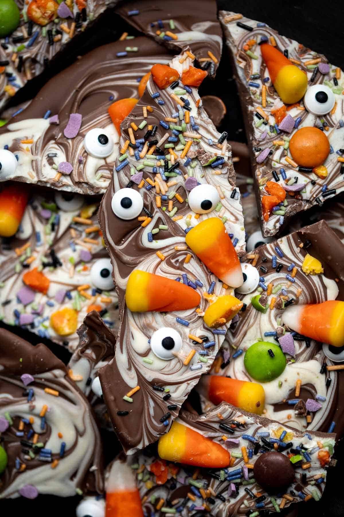 Halloween Bark is a delicious, sweet, and fun to make chocolate treat. This quick and easy no bake recipe is easy to make with a handful of ingredients. | aheadofthyme.com