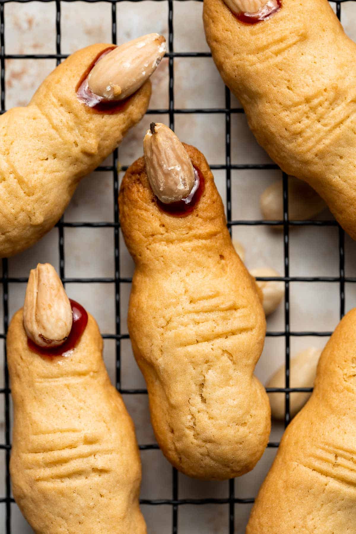 Get your cauldron bubbling, these creepy Witch Finger Cookies are here to stir up some Halloween fun. These spooky treats are quick, easy, and delicious. | aheadofthyme.com