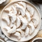 Almond Crescent Cookies are delicious and crumbly half-moon shaped cookies with a fragrant, sweet almond flavor and a delicate dusting of powdered sugar. | aheadofthyme.com