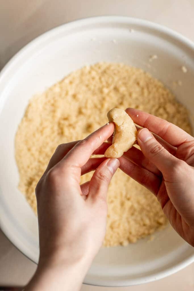 Almond Crescent Cookies are delicious and crumbly half-moon shaped cookies with a fragrant, sweet almond flavor and a delicate dusting of powdered sugar. | aheadofthyme.com