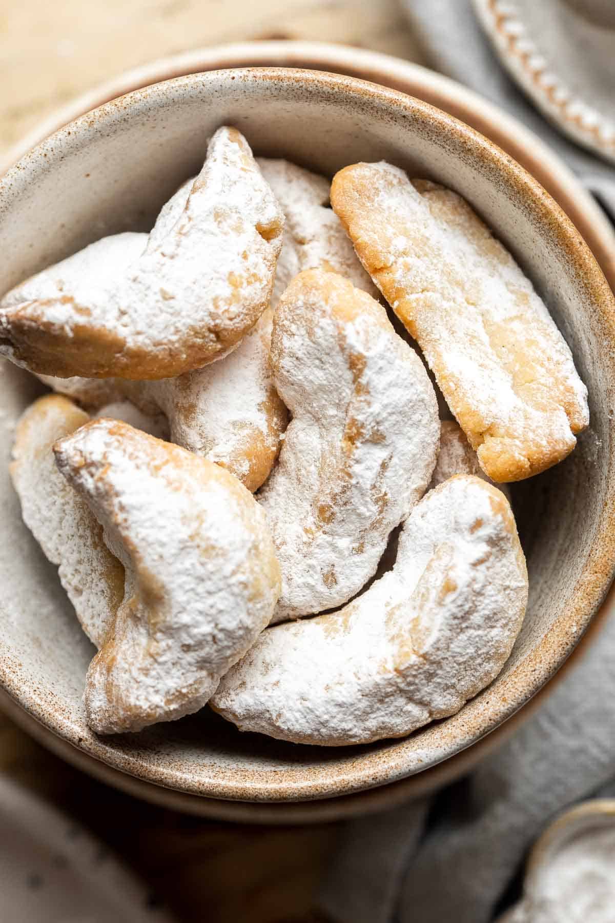 Almond Crescent Cookies are delicious and crumbly half-moon shaped cookies with a fragrant, sweet almond flavor and a delicate dusting of powdered sugar. | aheadofthyme.com