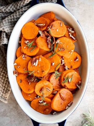 Candied Yams are tender, buttery, tangy, and sweet with a delicious brown sugar glaze. This simple Thanksgiving side dish is quick and easy to prepare. | aheadofthyme.com