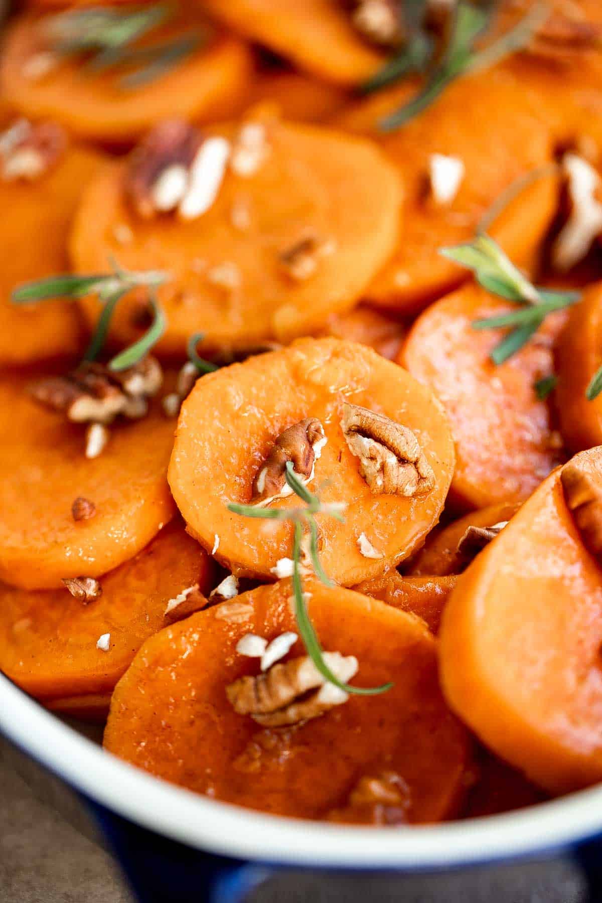 Candied Yams are tender, buttery, tangy, and sweet with a delicious brown sugar glaze. This simple Thanksgiving side dish is quick and easy to prepare. | aheadofthyme.com