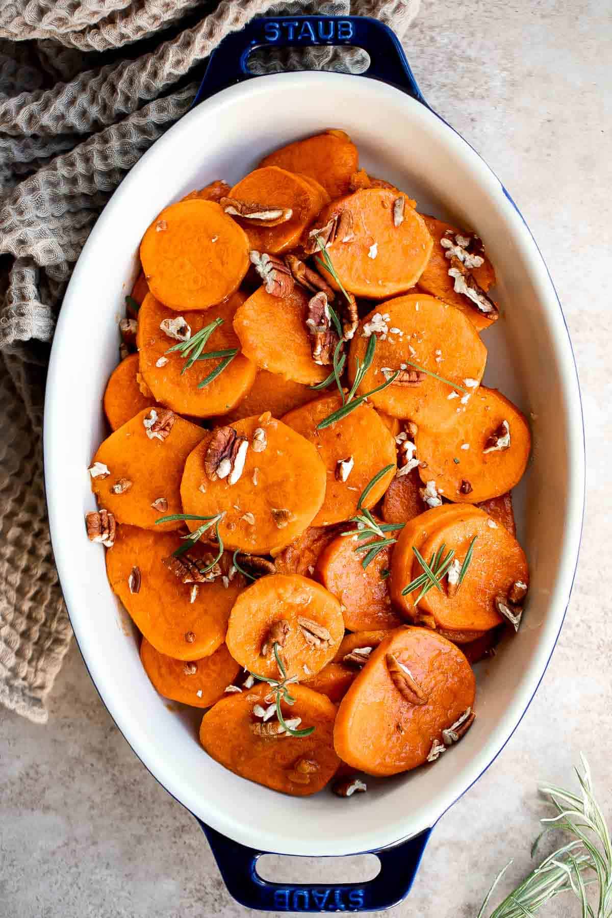 Candied Yams are tender, buttery, tangy, and sweet with a delicious brown sugar glaze. This simple Thanksgiving side dish is quick and easy to prepare. | aheadofthyme.com