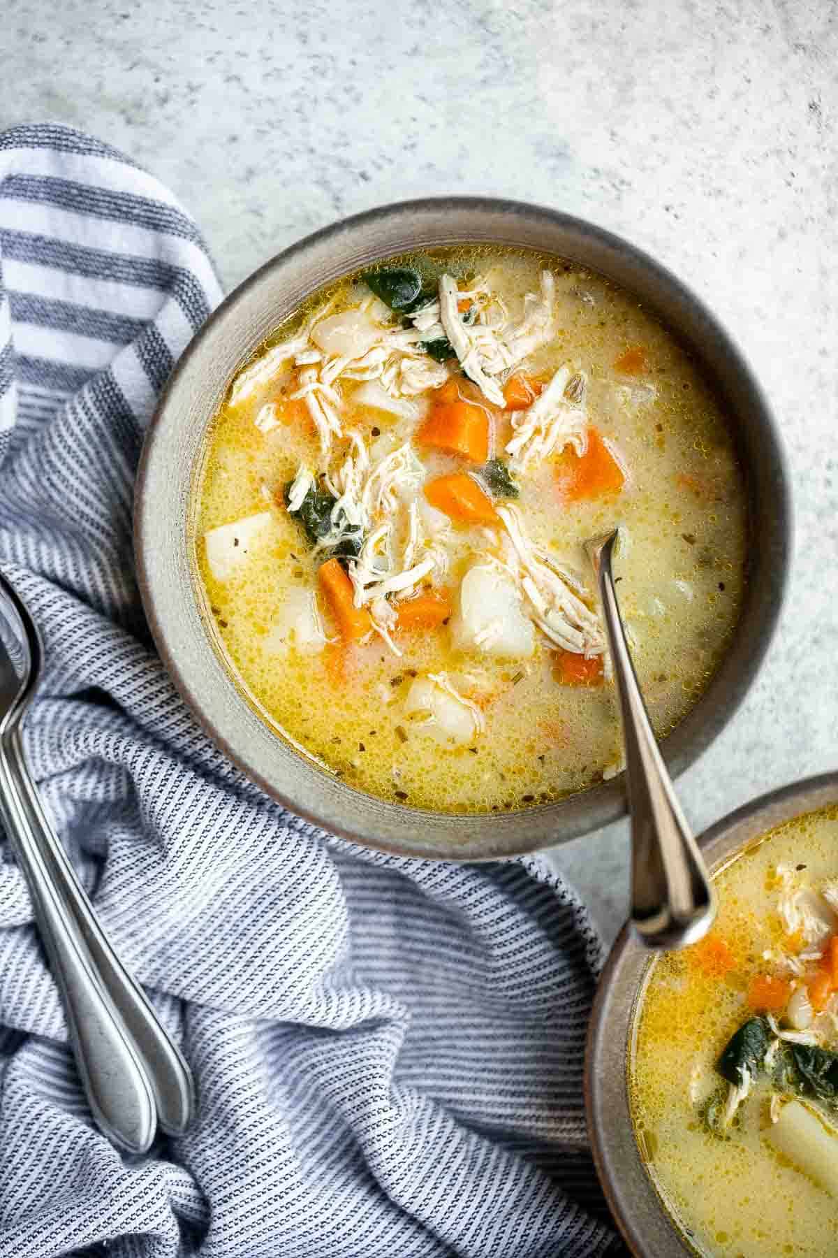 Chicken Potato Soup is cozy, hearty, and delicious — loaded with chicken, potatoes, veggies, and greens simmered in a creamy broth. Ready in 40 minutes. | aheadofthyme.com