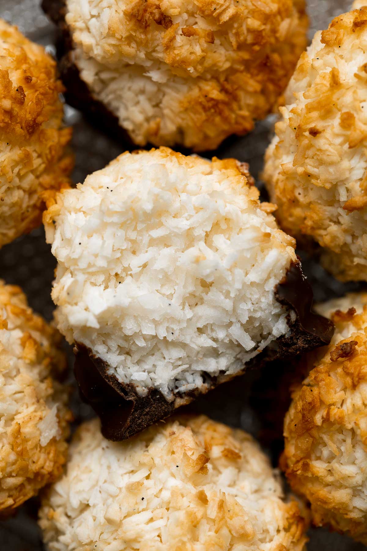 Coconut macaroons are crispy on the outside with a soft and chewy center. Dip or drizzle with chocolate for an even more delicious flavor combo. | aheadofthyme.com