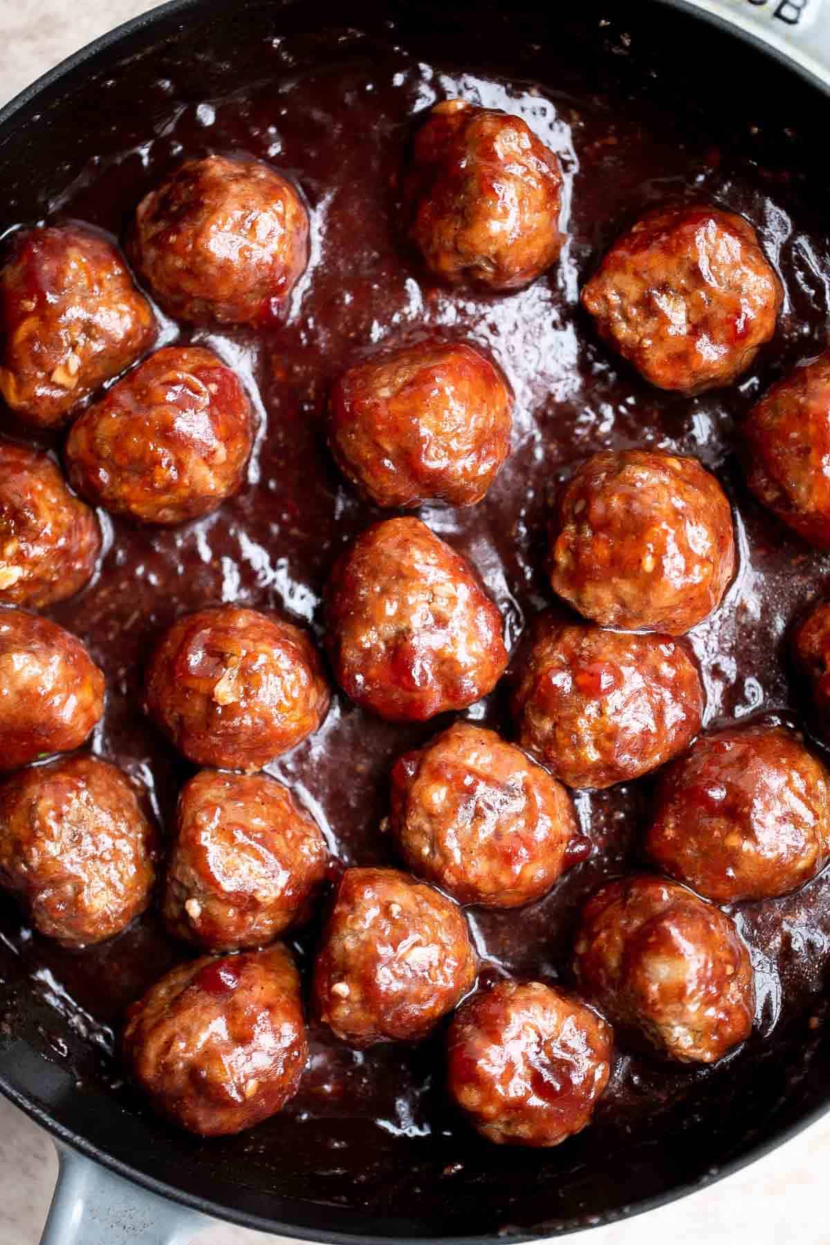 Cranberry Meatballs are sticky, sweet and tangy. These delicious bites are the perfect holiday appetizer, or a great way to use up leftover cranberry sauce. | aheadofthyme.com