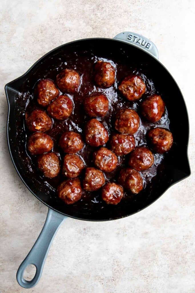 Cranberry Meatballs are sticky, sweet and tangy. These delicious bites are the perfect holiday appetizer, or a great way to use up leftover cranberry sauce. | aheadofthyme.com
