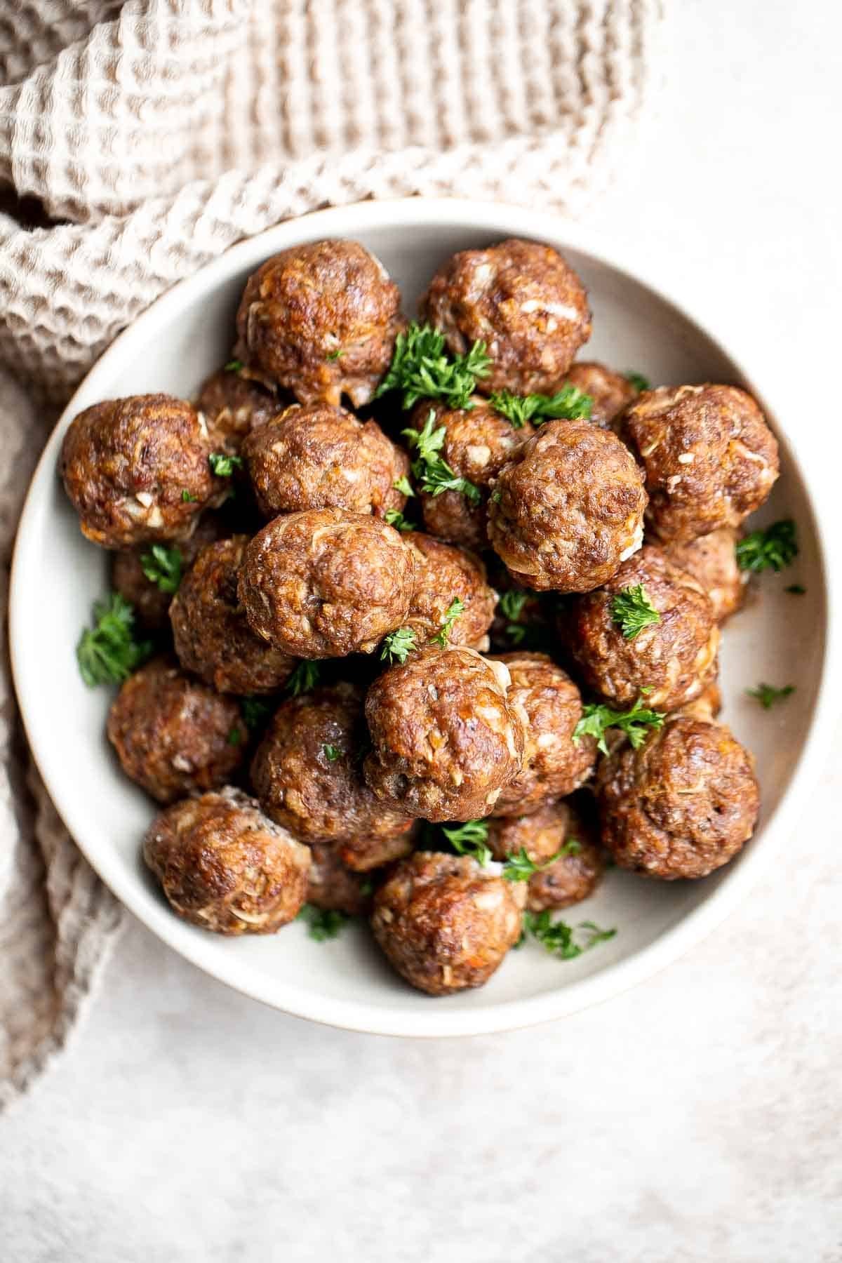 Easy Baked Meatballs are juicy, tender, loaded with flavor, and kid-friendly. Enjoy delicious homemade meatballs in under an hour using simple ingredients. | aheadofthyme.com