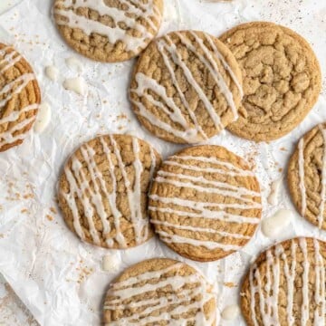 Eggnog cookies are a delicious soft and chewy holiday cookie with a crackly top. They are made with eggnog, spiced warmly, and drizzled with eggnog glaze. | aheadofthyme.com