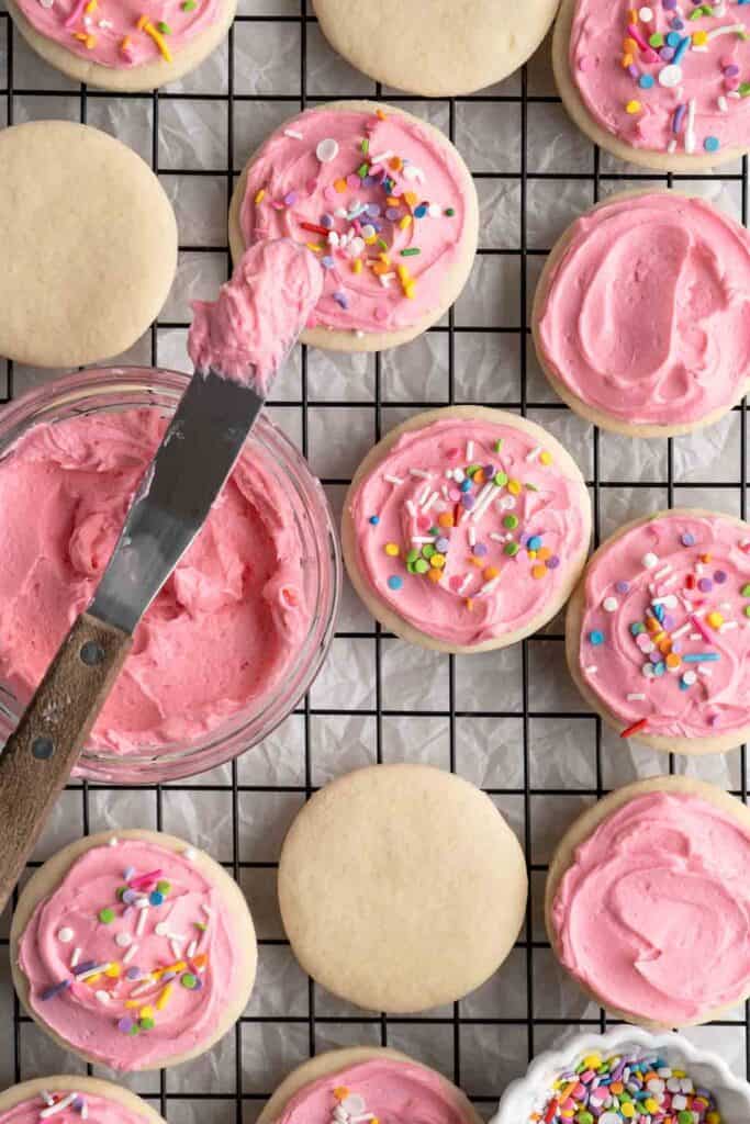 Lofthouse Cookies are super soft, moist, and thick, classic grocery store cookies made of a cakey sugar cookie, sweet buttercream frosting, and sprinkles. | aheadofthyme.com