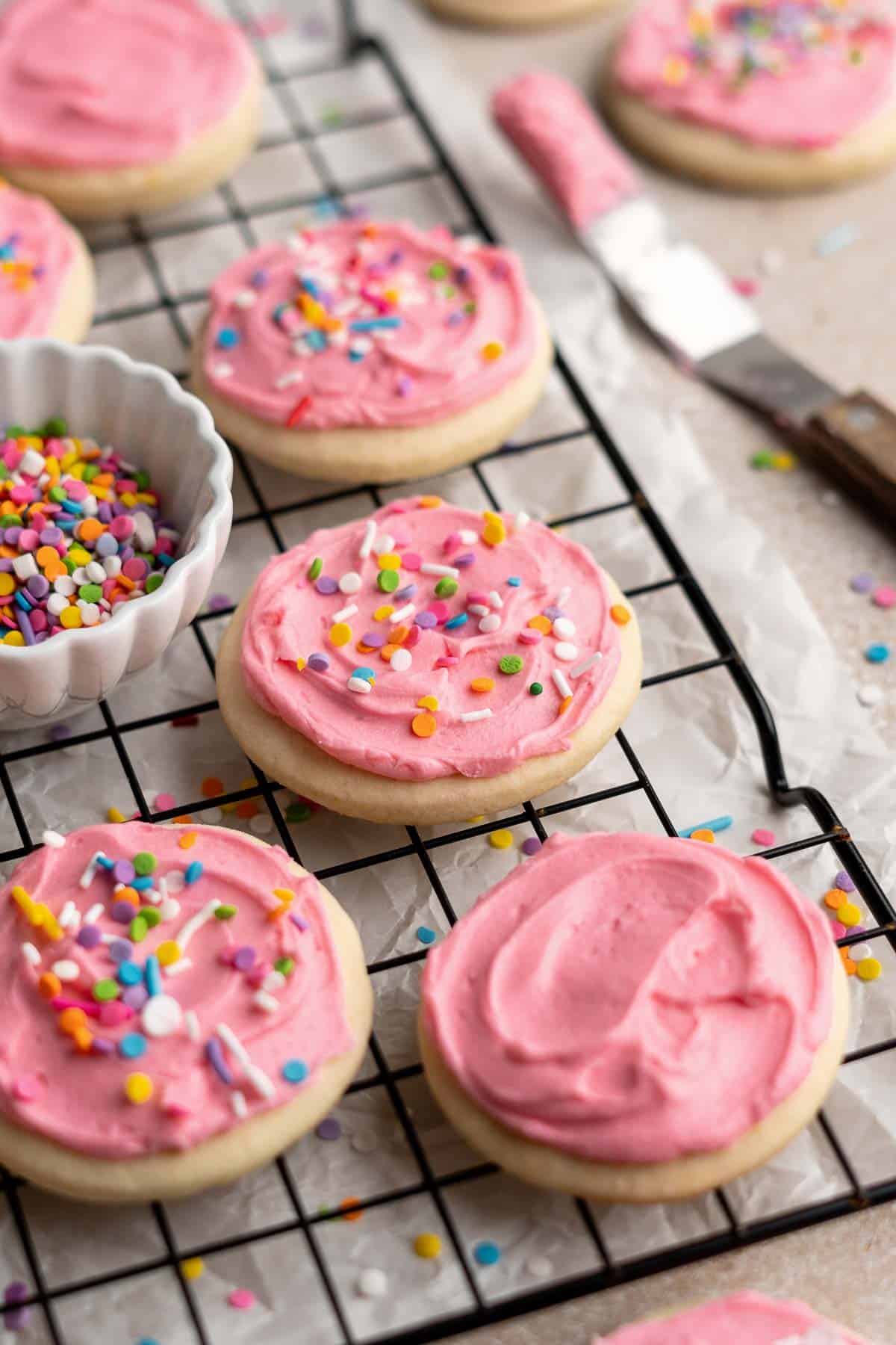 Lofthouse Cookies are super soft, moist, and thick, classic grocery store cookies made of a cakey sugar cookie, sweet buttercream frosting, and sprinkles. | aheadofthyme.com