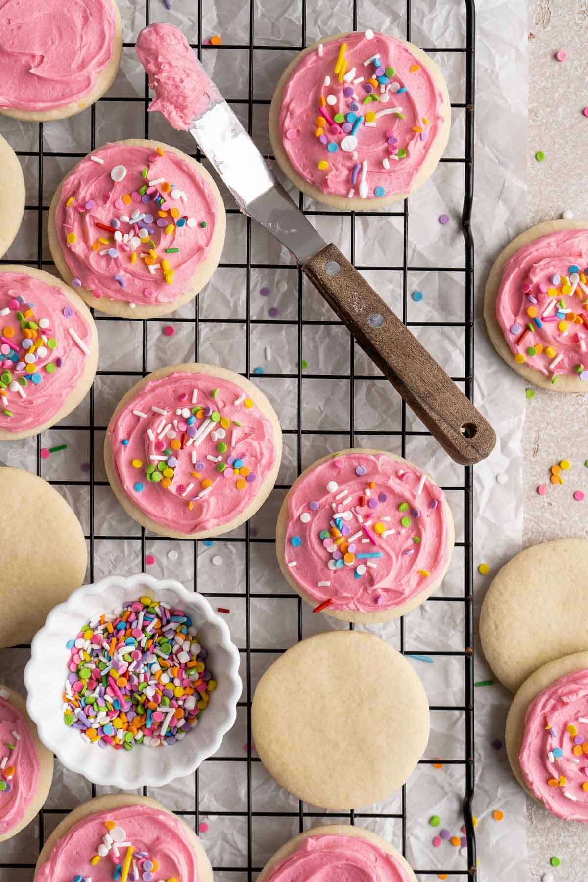 Lofthouse Cookies are super soft, moist, and thick, classic grocery store cookies made of a cakey sugar cookie, sweet buttercream frosting, and sprinkles. | aheadofthyme.com