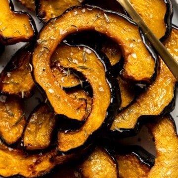 Maple Roasted Acorn Squash is savory and sweet, with its flavor intensified when tossed and roasted in a homemade maple glaze with a sprinkling of cinnamon. | aheadofthyme.com