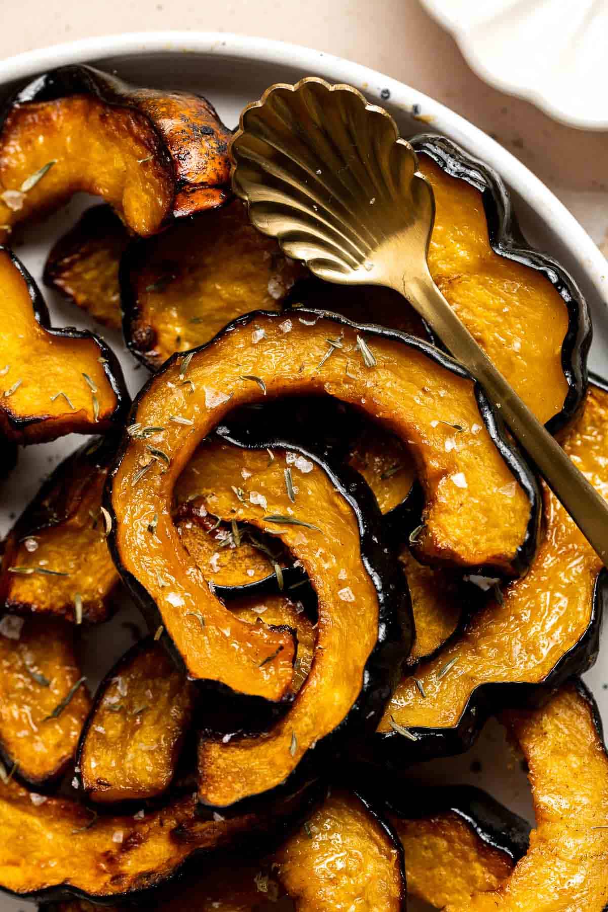 Maple Roasted Acorn Squash is savory and sweet, with its flavor intensified when tossed and roasted in a homemade maple glaze with a sprinkling of cinnamon. | aheadofthyme.com