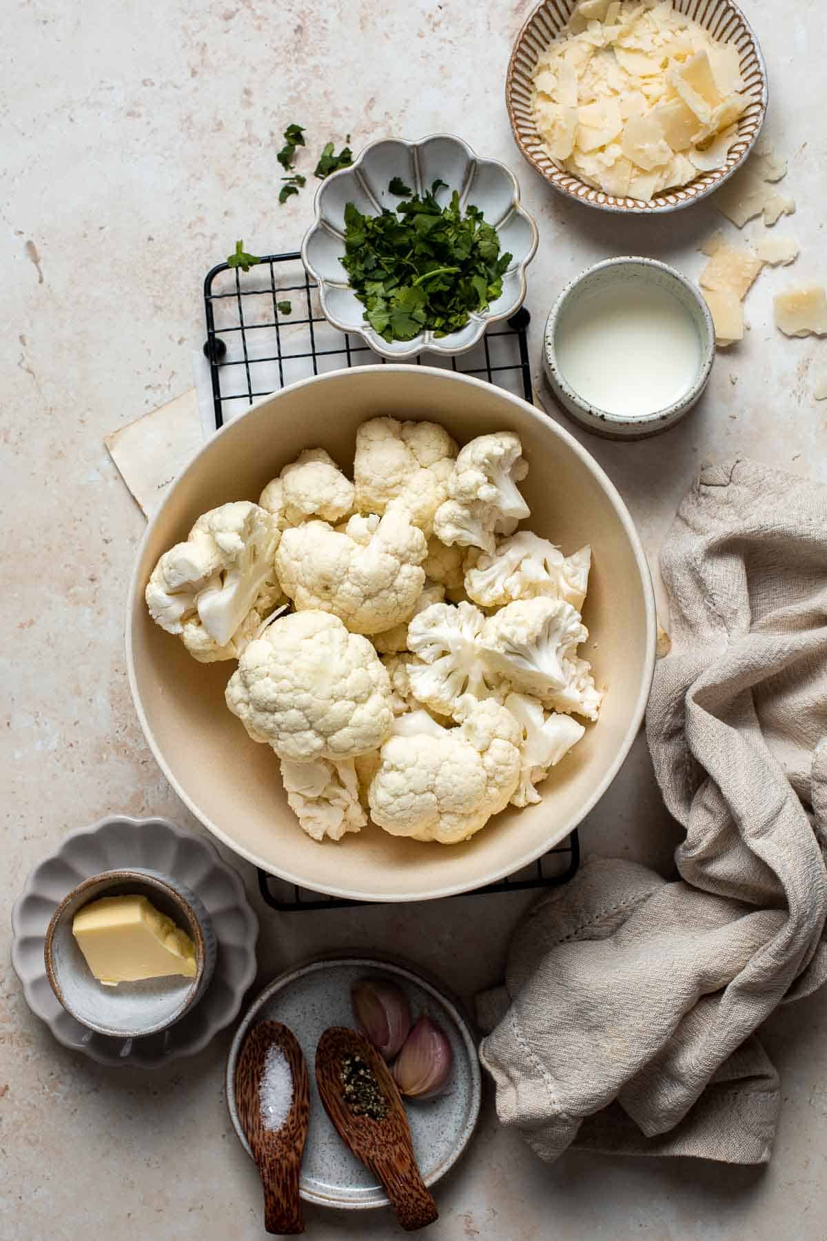 Mashed Cauliflower is a fluffy and buttery side dish and a low carb, keto-friendly alternative to mashed potatoes. Plus, it’s easier and quicker too! | aheadofthyme.com