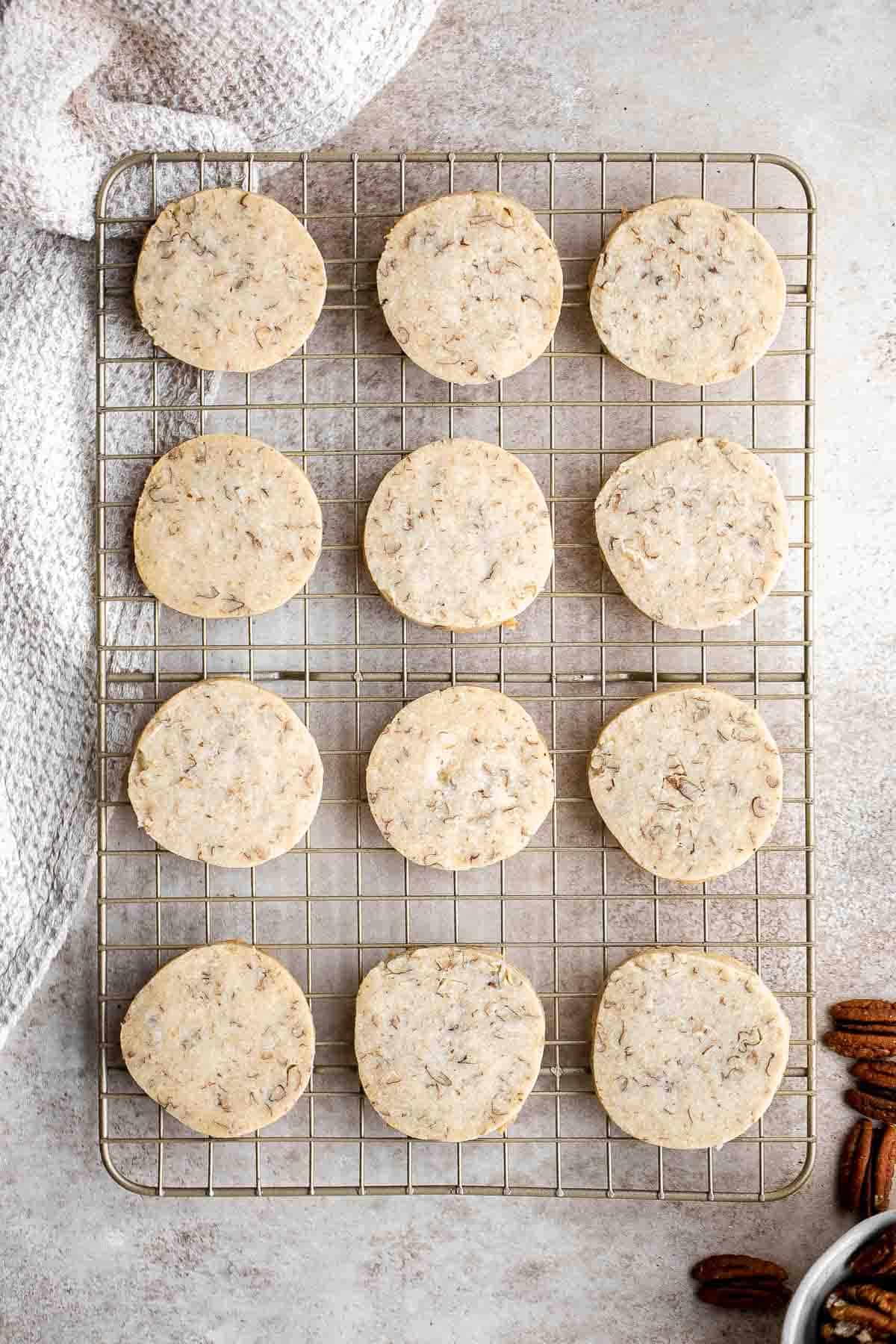 Pecan Sandies are easy, slice and bake shortbread cookies loaded with pecans and literally melt in your mouth. They’re sweet, buttery, nutty, and delicious. | aheadofthyme.com