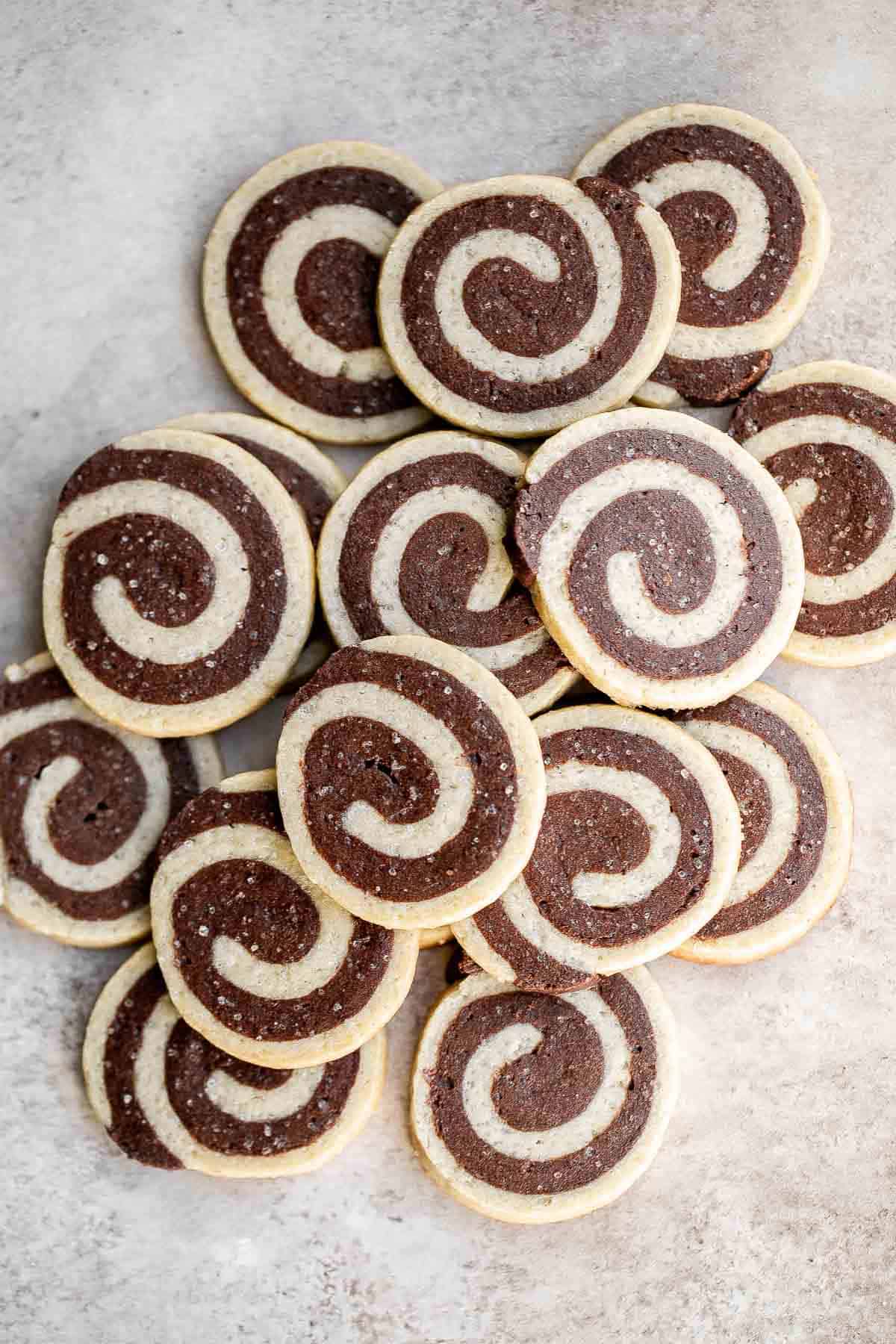 Chocolate Pinwheel Cookies are a Christmastime classic — sweet, buttery, and melt in your mouth delicious. Plus, an easy to make slice-and-bake cookie. | aheadofthyme.com