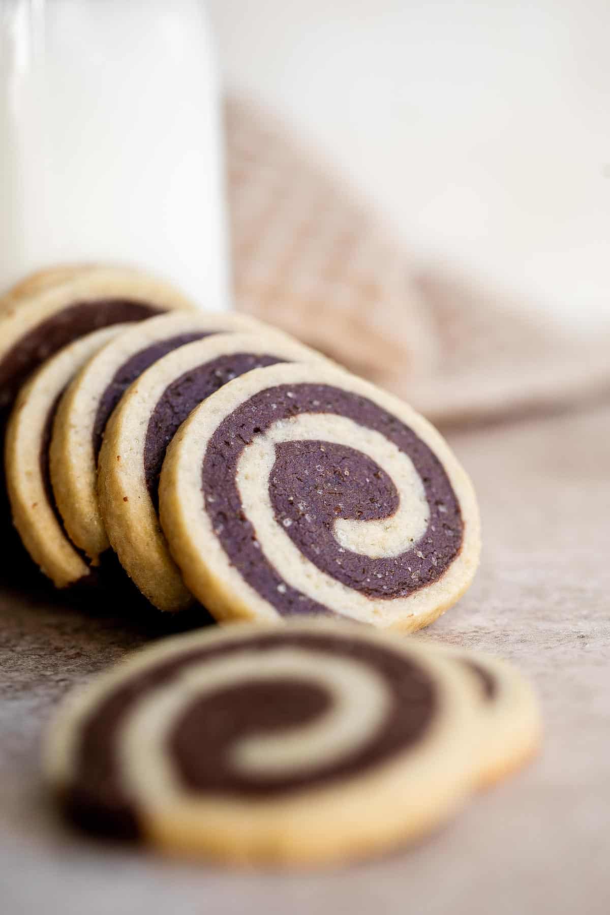 Chocolate Pinwheel Cookies are a Christmastime classic — sweet, buttery, and melt in your mouth delicious. Plus, an easy to make slice-and-bake cookie. | aheadofthyme.com